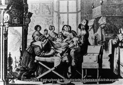 En förlossning i gammal tid
Omonterat fotografi märkt "Gynekologi". Inga andra identifierande påskrifter.
Nyckelord: Förlossning;Gynekologi;