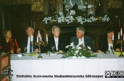 Bilder från ett Fernströmsymposium 1993 i Lund
Bilder från ett Fernströmsymposium 1993 i Lund. Kanske "Atrial Fibrillation - Mechanisms and Novel Therapeutic Strategies. Bildkälla Gunilla Sernelin. Foton från banketten i riddarsalen på Trolleholm. Fotograf okänd. Från vänster Elisabet Edholm Fernström, Fernströmsstiftelsens kanslidirektör Ingegärd Lindqvist, professor Håkan Westling och okänd kvinna.
