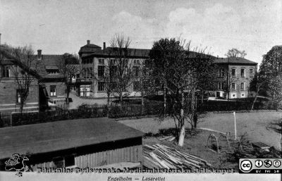 Tryckt vykort med texten Engelholm - Lasarettet.
Ängelholms lasarett. Tryckt vykort med texten Engelholm - Lasarettet. Foto rimligen under 1900-talets första halva. Bildkälla: Lillie Börjessons bildsamling från Ängelholms sjukhus.
Nyckelord: Ängelholm;Engelholm;Lasarett