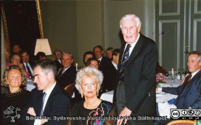 Philip Sandblom-symposium 1993 i Lund
Professor Philip Sandblom håller tal på Sandblomdagens bankett i Pelarsalen på Lunds Universitet. Margareta Ihse vid hans sida, sittande. Elisabeth Fernström sittande längst till vänster i bilden..Foto.
Nyckelord: Lasarettet;Lund;Universitetssjukhuset;USiL;Kirurgiska;Kliniken;Symposium;Möte;Fest;Bankett